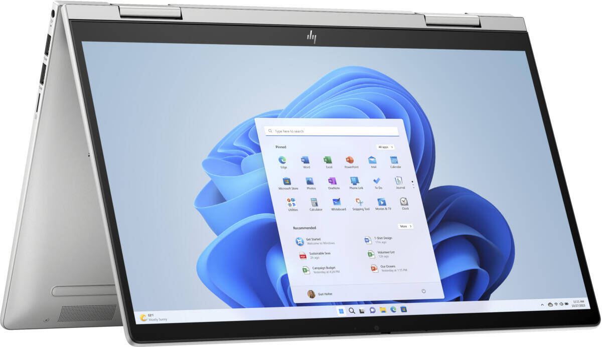 Folded into Tent Mode HP Envy x360 convertible Laptop (White) Showing Windows desktop background. 